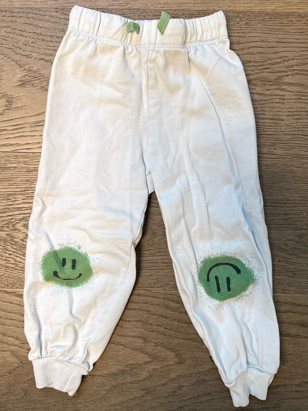 Molo White Joggers with Green Smiley Knee Patches